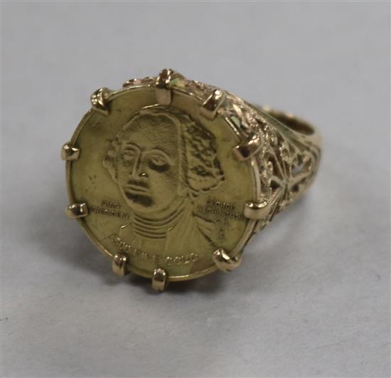 A 9ct gold ring with inset U.S. gold bi-centennial coin, size M.